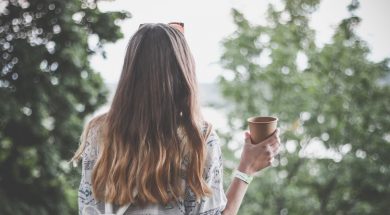 woman outdoors with coffee