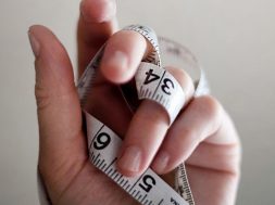 Persons-hand-holding-a-tape-measure.jpg
