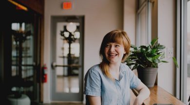 Woman-in-a-cafe-smiling-by-Brooke-Cagle-Unsplash.jpg