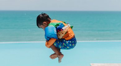 Young-boy-jumping-into-pool.jpg